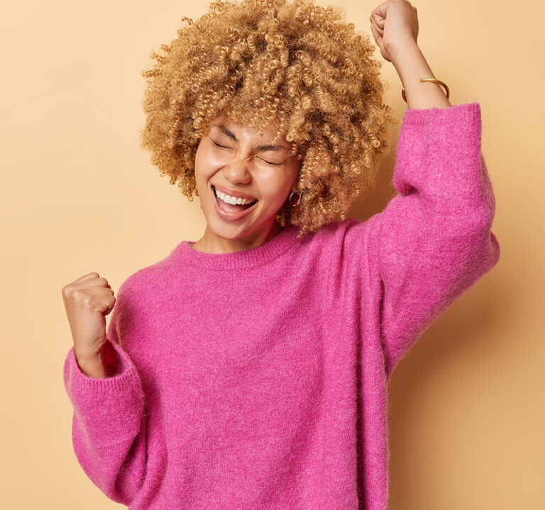 Excited woman designing her own custom printed box