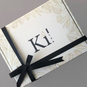 Elegant custom printed gift box with black ribbon and gold leaf pattern